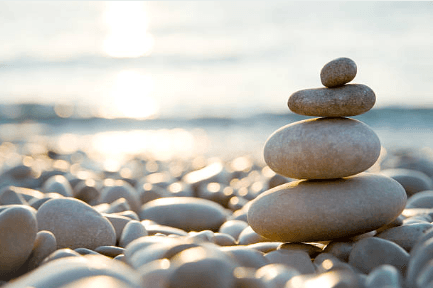 Stacked balanced rocks representing mindfulness and calm